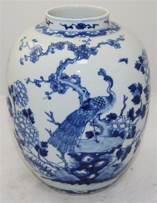 A Chinese blue and white ovoid jar, Kangxi mark, late 19th century, 32cm, wood stand